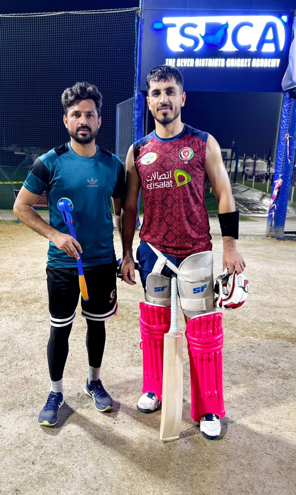 Waseem Arif with a professional cricketer at a cricket academy
